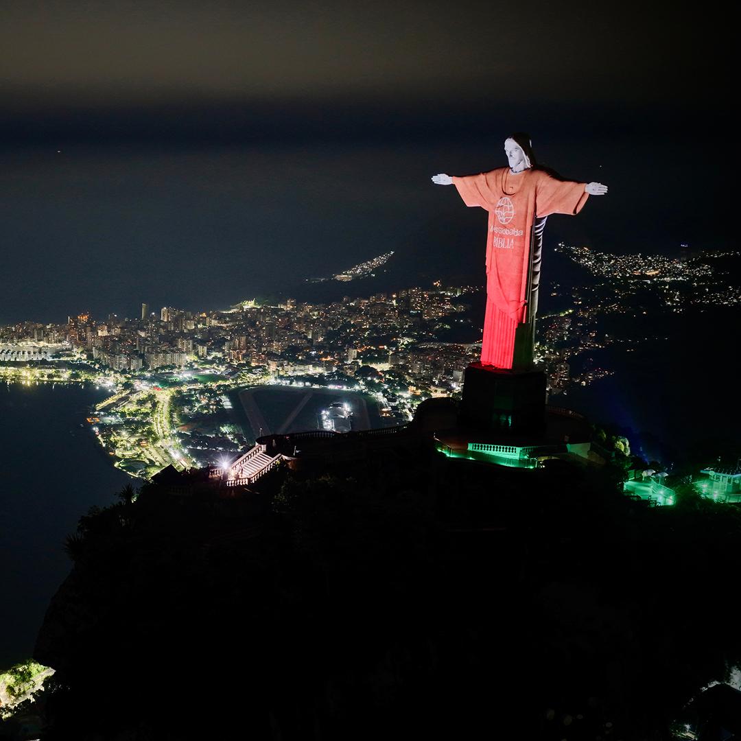 YouVersion ad illuminates the Christ the Redeemer statue with the Rio skyline in the background.